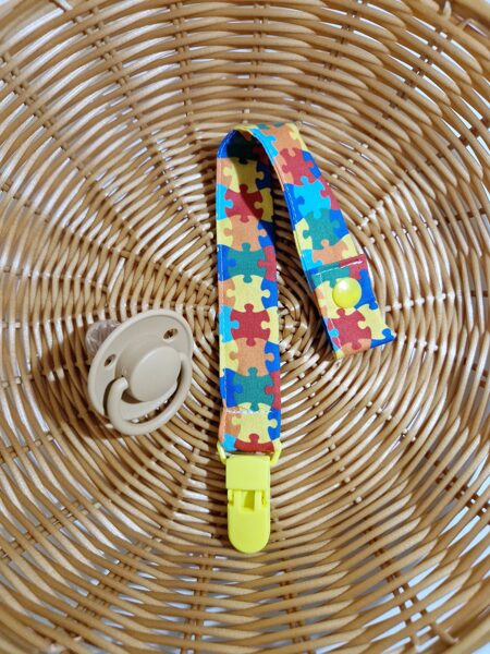 Auduma knupīša turētāji